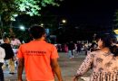 CarryMen shopping assistant helper walking with a customer in a busy night market.